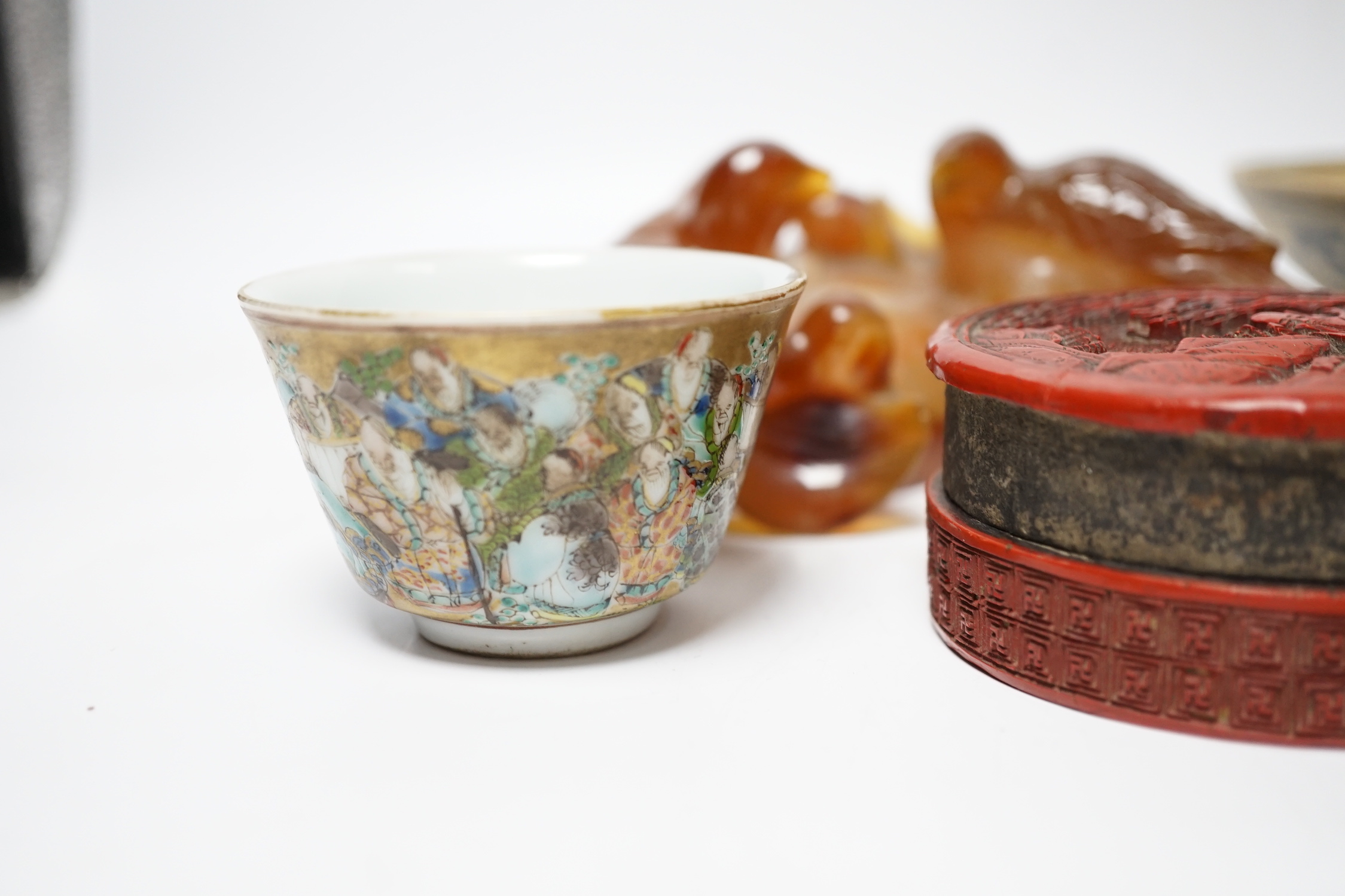 Eleven Chinese or Japanese items including; a bowl, a red lacquer box, an agate carving of a bird group, a carved hardstone lion tortoise, mother of pearl counters, etc.